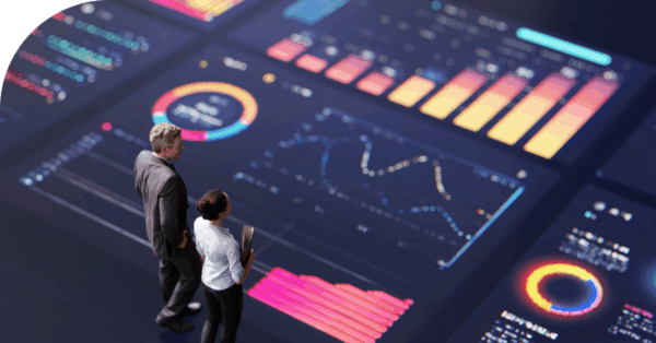 Image of two people viewing digital advertising data.